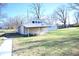 Small house with covered porch and a large backyard at 3235 Adams St, Indianapolis, IN 46218