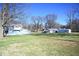 House exterior with large yard and detached garage at 3235 Adams St, Indianapolis, IN 46218