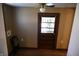 View of a hallway with a door leading outside at 3235 Adams St, Indianapolis, IN 46218