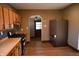 Eat-in kitchen with stainless steel appliances and wood cabinets at 3235 Adams St, Indianapolis, IN 46218