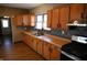 Updated kitchen with wood cabinets and new appliances at 3235 Adams St, Indianapolis, IN 46218