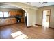 Open living room with kitchen and bathroom access at 3235 Adams St, Indianapolis, IN 46218