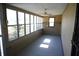 Screened porch with ceiling fan and side door at 3235 Adams St, Indianapolis, IN 46218