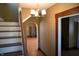 Elegant staircase with chandelier and hardwood floors at 3235 Adams St, Indianapolis, IN 46218