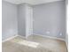 Simple bedroom with neutral walls, carpet flooring, and a closet at 355 Mcclure Rd, Columbus, IN 47201