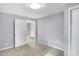 Bright bedroom with neutral walls, carpet flooring, and a closet at 355 Mcclure Rd, Columbus, IN 47201