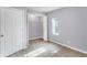 Well-lit bedroom with a walk-in closet and neutral decor at 355 Mcclure Rd, Columbus, IN 47201