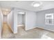 Long hallway with neutral walls and new carpet at 355 Mcclure Rd, Columbus, IN 47201