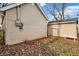 Rear view of house with detached garage and yard at 355 Mcclure Rd, Columbus, IN 47201