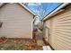 Side yard with detached garage and fence at 355 Mcclure Rd, Columbus, IN 47201