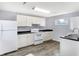 Modern kitchen with white cabinets and new appliances at 355 Mcclure Rd, Columbus, IN 47201