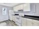 Modern kitchen with white cabinets and new appliances at 355 Mcclure Rd, Columbus, IN 47201