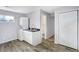 Functional laundry room with a toilet and additional storage at 355 Mcclure Rd, Columbus, IN 47201