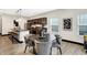 Modern dining area with a round table and four gray chairs at 416 Eastern Ave, Indianapolis, IN 46201