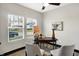 Bright home office with two chairs, a desk, and a large window at 416 Eastern Ave, Indianapolis, IN 46201