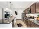 Contemporary kitchen with stainless steel appliances and an island with seating at 416 Eastern Ave, Indianapolis, IN 46201