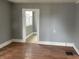 Simple dining room with hardwood floors and access to kitchen at 430 S Proud St, Muncie, IN 47305