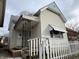 House exterior showcasing front porch and white picket fence at 430 S Proud St, Muncie, IN 47305