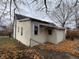 Rear view of house with additional building and yard at 430 S Proud St, Muncie, IN 47305