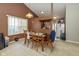 Bright dining area with a wooden table and chairs, open to the kitchen at 6171 E Newberry Ct, Camby, IN 46113