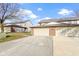 View of the front of a two-story townhouse with a two-car garage at 6454 Bay Harbor Ln, Indianapolis, IN 46254