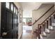 Entryway with staircase and view into living room at 6520 Cricklewood Rd, Indianapolis, IN 46220