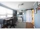 Bright home office features built-in shelving and a charming sliding barn door at 6520 Cricklewood Rd, Indianapolis, IN 46220