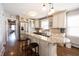 Modern kitchen with granite island, stainless steel appliances, and hardwood floors at 6520 Cricklewood Rd, Indianapolis, IN 46220