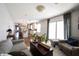 Open living room featuring hardwood floors and a view into the updated kitchen at 6520 Cricklewood Rd, Indianapolis, IN 46220