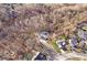 Aerial view of a wooded lot with a house at 7650 Clarion Dr, Indianapolis, IN 46236
