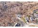 Aerial view of a house nestled in a wooded lot at 7650 Clarion Dr, Indianapolis, IN 46236