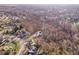 Aerial view of a lot with a house and surrounding trees at 7650 Clarion Dr, Indianapolis, IN 46236