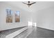 Spacious bedroom with hardwood floors and large windows at 7650 Clarion Dr, Indianapolis, IN 46236