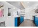 Modern kitchen with blue cabinets, an island, and stainless steel appliances at 7650 Clarion Dr, Indianapolis, IN 46236