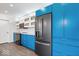 Modern kitchen with blue cabinets, stainless steel appliances and quartz countertops at 7650 Clarion Dr, Indianapolis, IN 46236