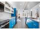 Modern kitchen with blue cabinets, stainless steel appliances and a large island at 7650 Clarion Dr, Indianapolis, IN 46236