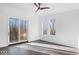 Spacious living area with hardwood floors, large windows, and sliding glass doors at 7650 Clarion Dr, Indianapolis, IN 46236