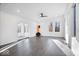 Bright living room featuring a fireplace and hardwood floors with lots of natural light at 7650 Clarion Dr, Indianapolis, IN 46236