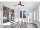 Sunroom with sliding glass doors, hardwood floors, and ample natural light at 7650 Clarion Dr, Indianapolis, IN 46236