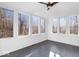 Sunroom with hardwood floors and multiple windows offering natural light at 7650 Clarion Dr, Indianapolis, IN 46236