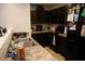 Kitchen with dark brown cabinets, stainless steel sink and appliances at 7720 Bolero Dr, Camby, IN 46113