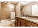 Bathroom with granite countertop, bathtub, and shower at 7885 Clearwater Pkwy, Indianapolis, IN 46240