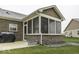 Screened porch with brick flooring and backyard access at 8831 Twain Ln, Indianapolis, IN 46239