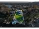 An aerial view showcasing a waterfront home with a large backyard and private dock at 9454 Raintree S Dr, Columbus, IN 47201