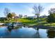 Aerial view of the property showcasing its lakefront location and landscaping at 9454 Raintree S Dr, Columbus, IN 47201