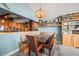 Cozy breakfast nook with built-in bench seating and a charming chandelier at 9454 Raintree S Dr, Columbus, IN 47201
