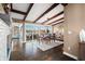 Spacious dining room with lake views, exposed beams, and hardwood floors at 9454 Raintree S Dr, Columbus, IN 47201
