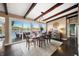 Elegant dining room featuring hardwood floors and access to a deck with lake views at 9454 Raintree S Dr, Columbus, IN 47201