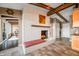 White brick fireplace with built-in seating and wood beams at 9454 Raintree S Dr, Columbus, IN 47201