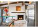 White brick fireplace with built-in seating and stylish artwork at 9454 Raintree S Dr, Columbus, IN 47201